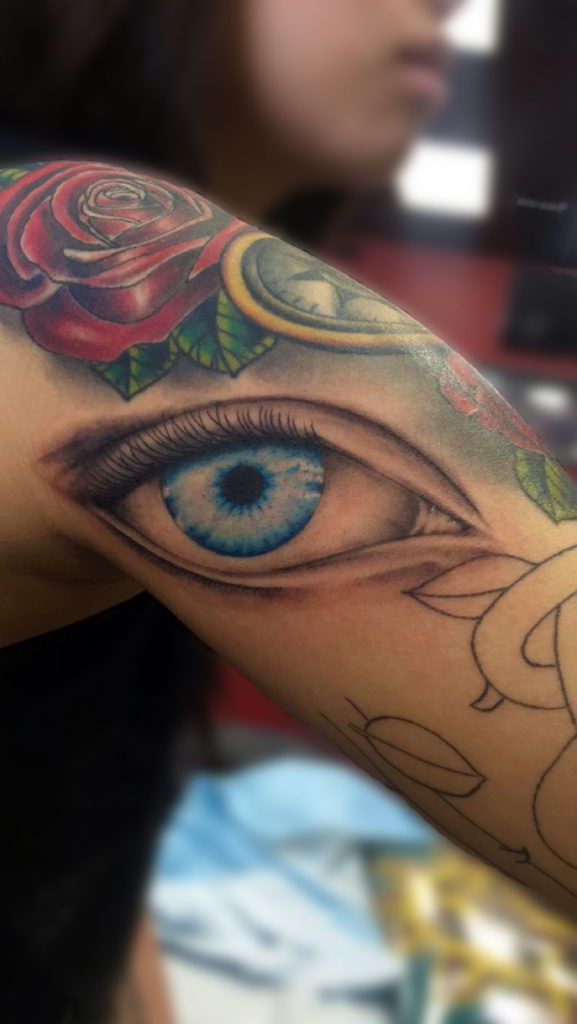 Q Tatttoo in Huntington Beach - Sara Delara - blue eye