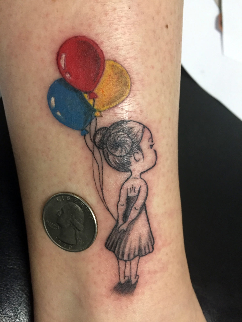 Q Tattoo in Huntington Beach - Karel Beck - the girl with her balloons - small tattoo
