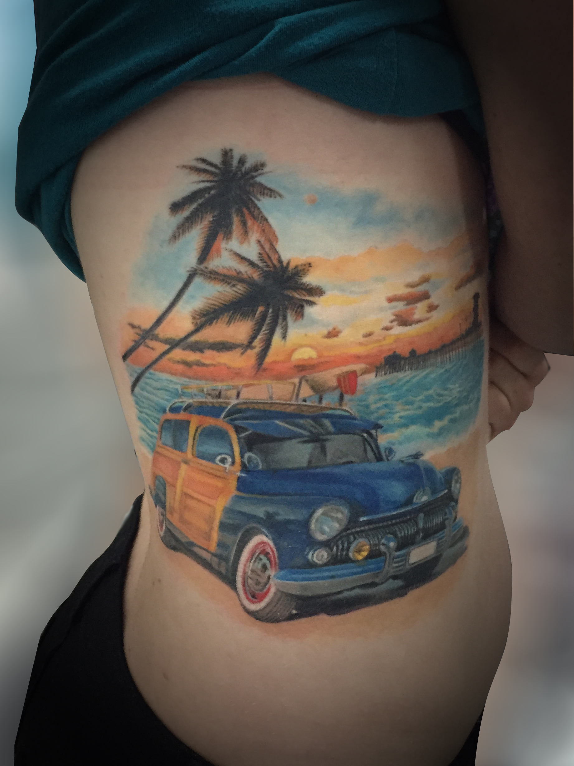 Q Tattoo in Huntington Beach - Karel Beck - olide, beach, woody