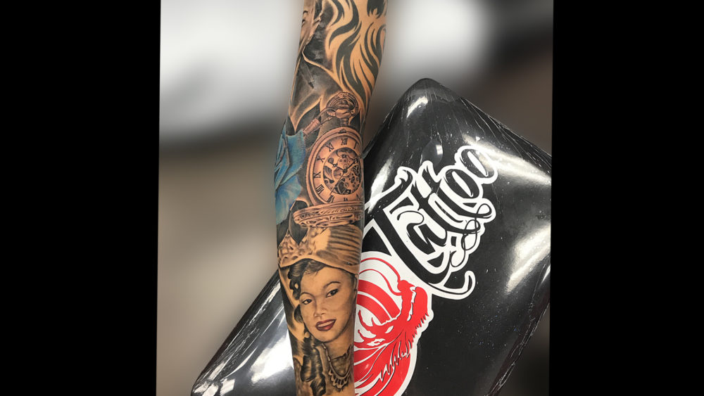 Q Tattoo in Huntington Beach - Quan - realism woman portrait with clock
