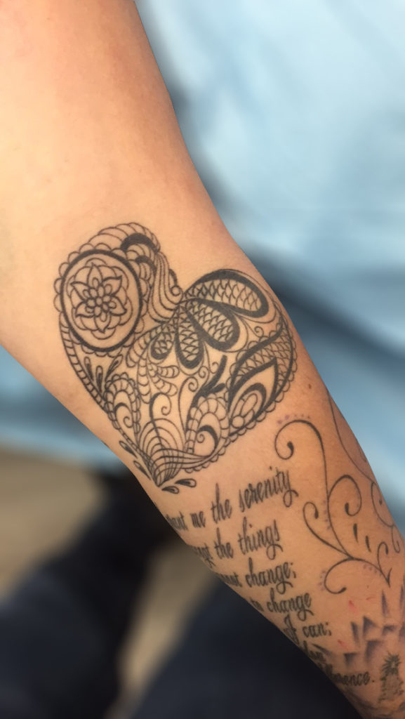 Q Tattoo in Huntington Beach - Sara Delara - floral heart